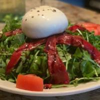 Burrata Insalata · Baby arugula, sliced tomatoes, and roasted peppers drizzled with extra virgin olive oil