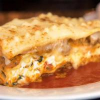 Lasagna · Layers of pasta, ricotta, and bolognese sauce, topped with Vincent's 