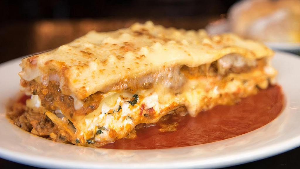 Lasagna · Layers of pasta, ricotta, and bolognese sauce, topped with Vincent's 