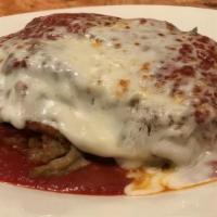 Eggplant Parmigiana · Layers of tendered eggplant and melted mozzarella, served with pasta