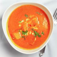 Chicken Tikka Masala · Tender boneless chicken, cooked in creamy tomato sauce with spices. Served with rice.