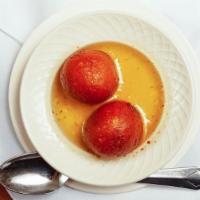 Gulab Jamun · A light pastry made from dry milk and served in honey syrup.
