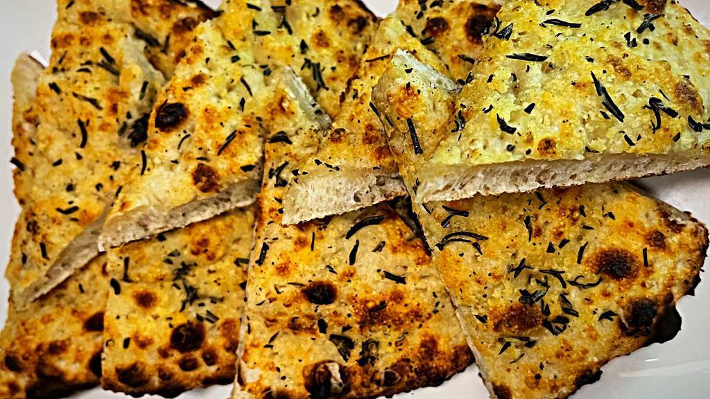 Flat Bread (Home Made) · Fresh made to order, Flat bread with Rosemary & Special Ungaro Seasonings baked in our Coal Fired oven.
