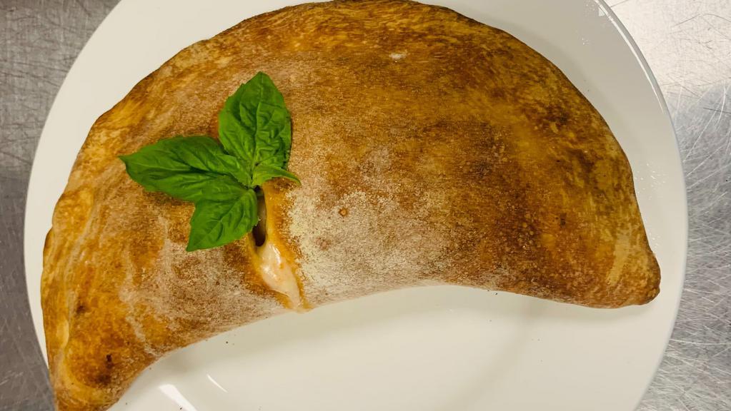Panzerotto - (Baked, Not Fried) · Oven Baked Calzone Molese Style. Filled with Freshly Ground Italian Tomatoes and Mozzarella.