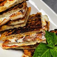 Chicken Parmigiana Panini · Fried Chicken Cutlets with Marinara sauce and Melted Mozzarella in our homemade Panini Bread.