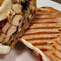 Grilled Chicken Whole Wheat Wrap · Grilled Chicken with melted Fresh Mozzarella, Sun dried Tomatoes, Red Onion & Creamy Pesto i...