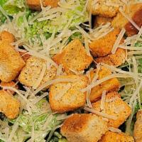 Classic Caesar Insalata · Romaine Hearts, Seasoned Croutons, Topped with Shaved Parmigiano Reggiano Cheese with Caesar...