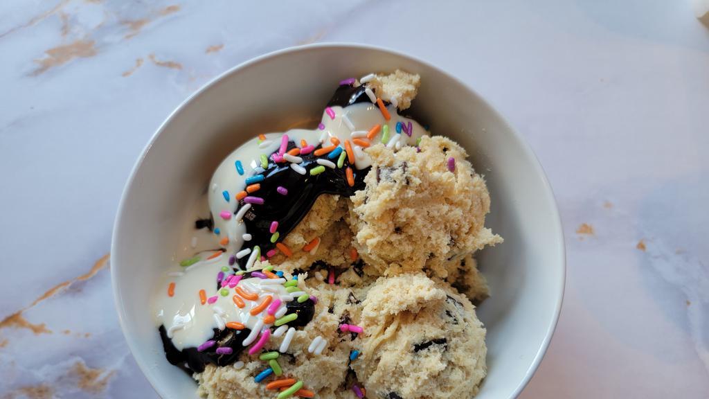 Ooey Gooey Cookie Dough Dream · Original Chocolate Chunk Cookie Dough Smothered in Hot Fudge, Creamy Marshmallow Sauce and Rainbow Sprinkles.