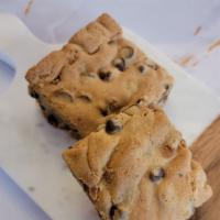 Warm Blondie · Pecans, Walnuts and Chocolate Chips Warmed Up Into the Best Blondie Around Town
