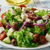 Mediterranean Salad · Chopped romaine lettuce, tomatoes, cucumbers, corn, olives topped with feta cheese mixed wit...
