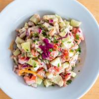 Large Jerusalem Salad · Fresh tomatoes, cucumbers, green peppers, onions, parsley, and tahini sauce.