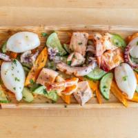 Mixed Seafood Platter · Marinated char-grilled octopus, calamari, jumbo shrimp, and salmon fillet.