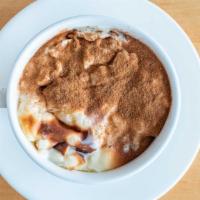 Rice Pudding · Oven-baked juicy, tasty rice pudding topped with cinnamon.