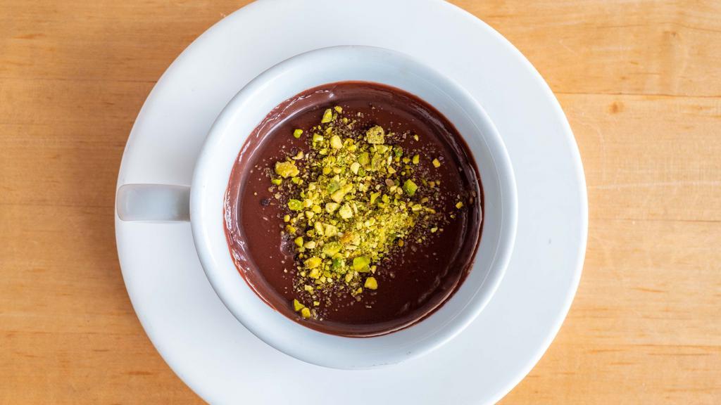 Chocolate Pudding · Dark chocolate and organic cocoa powder baked in the oven and topped with pistachio.