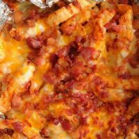 Cheesy Fries · Served with mozzarella, cheddar, bacon and 1 side of any sauce. Extra sauce for an additiona...