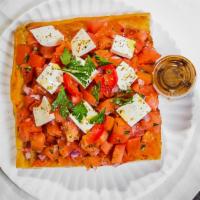 Caprese Pie · A freshly baked Sicilian focaccia with layers of homemade Mozzarella, thick ripe slices of g...