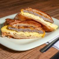 Breakfast Sandwich · Egg patty with your choice of Meat and cheese on a toasted bagel or Croissant