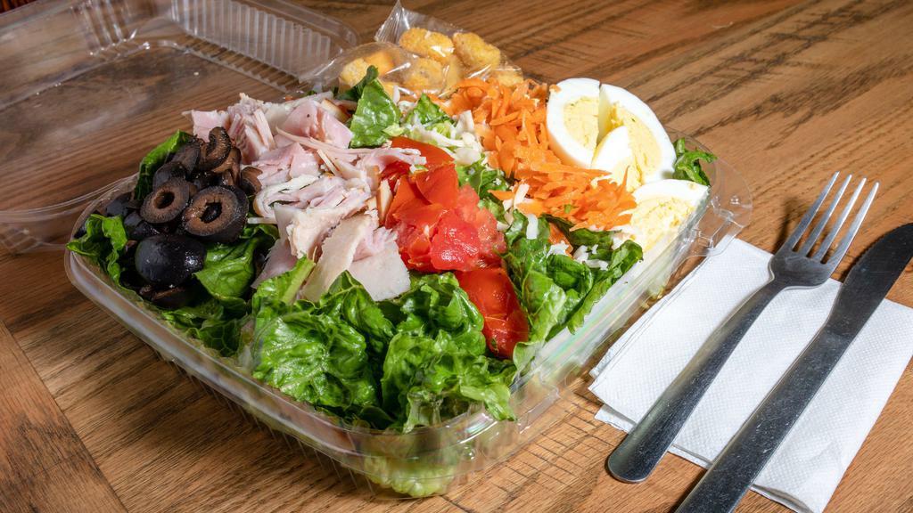 Club Salad · Large. Turkey, ham, cheese, olives, egg, carrots tomatoes & a boiled egg.