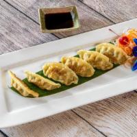 Gyoza · Made fresh by hand, served pan fried or steamed in our homemade pot sticker sauce.