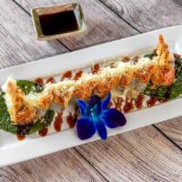 Snow White Roll · Shrimp tempura, avocado with spicy crab on top.