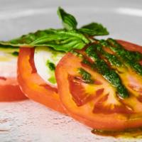 Caprese Salad · Fresh mozzarella & tomatoes, Italian dressing.