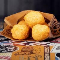 Mac And Cheese Bites · Clusters of macaroni and cheese breaded and deep fried.