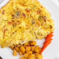 Vegetable Omelet · Tomato, peppers, onions, and mushroom. Omelets made with 3 eggs and 100% butter. Served with...