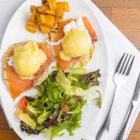 Eggs Benedict Salami · Eggs benedict made with English muffin topped with hollandaise sauce and served with house s...