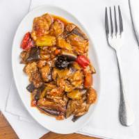 Eggplant Tomato Sauce · Cubes of fried eggplant mixed with fresh tomato, peppers, onions, and garlic.