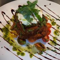 Eggplant Tower · Layers of fried eggplant with cherry tomatoes, roasted burrata topped with pesto and aged ba...