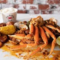 Snow Crab Legs Combo · All Combos come with: 1/2 pound of Shrimp, 1/2 pound clams, 1/2 pound mussels 2 corn, 3 pota...