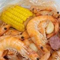 Naked Shrimp · Whole, shell-on, peel & eat shrimp cooked in our signature seafood boil. Includes corn, pota...