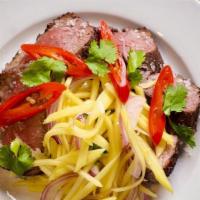 Roasted Duck · 8oz duck breast, mango & onion curtido, pickled peppers, cilantro.