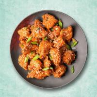 Smackin' Chilli Chicken · Wok Tossed Chicken with a crispy outing and is soft and juicy on the inside, smothered in st...
