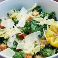 Kale Caesar Salad · Kale, shaved parmesan, our homemade croutons and caesar dressing.