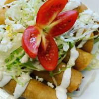 Five Flautas · Crispy fried taquito filled with tinga chicken or cheese, topped with lettuce, sour cream, a...