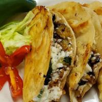Spicy Vegetarian Mexican Quesadillas · Set of three semi-fried corn tortillas w/ roasted zuchini, mushrooms, epazote leaves, sliced...