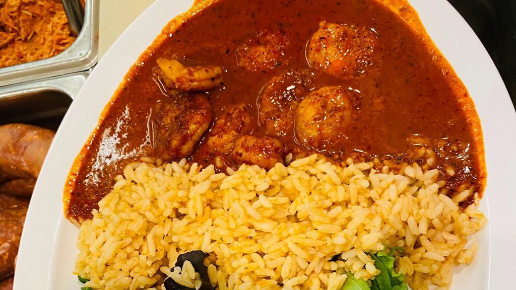 Camaronez Ala Diabla · Sautè Shrimp slowly cook in a creamy guajillo sauce and served over mescaline salad and mexican rice and garnish with sliced avocados and cherry tomatoes