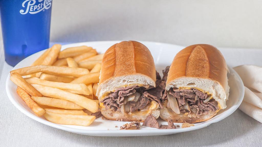 Philly Cheese Steak · Served with American cheese and fried onions, served with french fries.