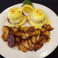 Crab Cake Benny · Two poached eggs and home made crab cakes on an English muffin topped with hollandaise sauce.