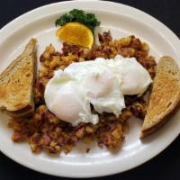 Corned Beef Hash · Home made hash topped with two poached eggs and toast