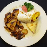 Breakfast Wrap · Two eggs scrambled, choice of cheese and choice of meat. Wrapped in a flour tortilla