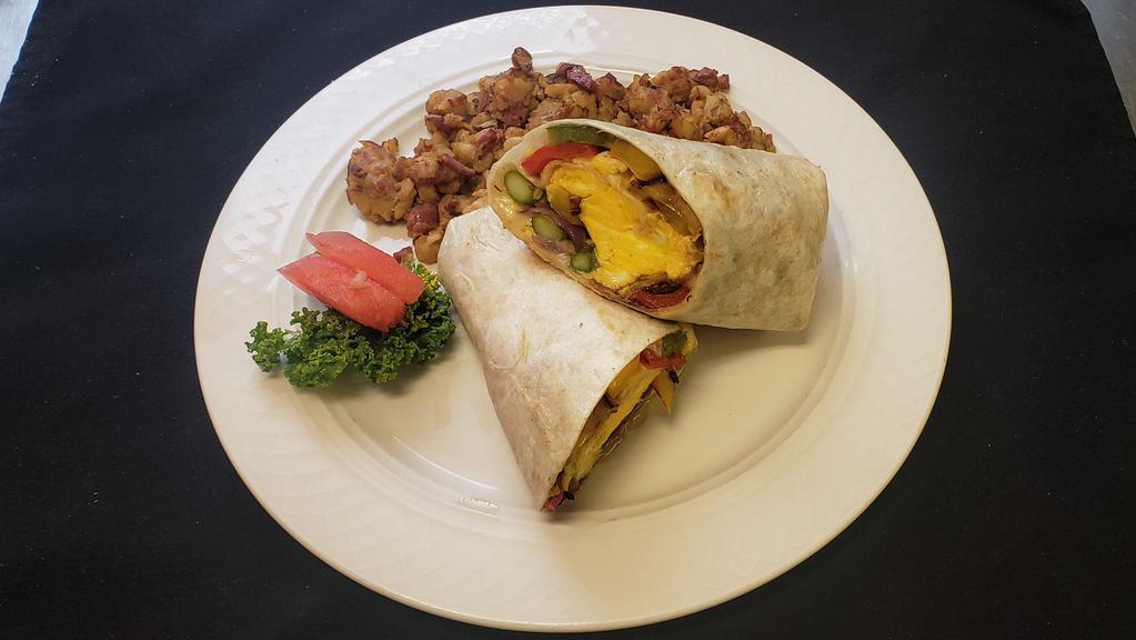 Grilled Veggie Breakfast Wrap · Grilled asparagus, red and green peppers, red onion, zucchini, yellow squash, eggs and swiss cheese.