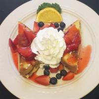 Stuffed French Toast · Jamaican style bread stuffed with Bavarian cream and garnished with strawberries and blueber...