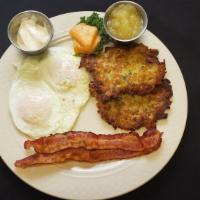 Potato Latkes · 2 Home made potato pancakes, 2 eggs and 2 strips of bacon. Served with apple sauce and sour ...