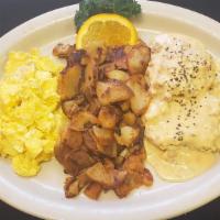 Italian Sausage Biscuits And Gravy · Home style biscuits smothered with gravy, two eggs and home fries.