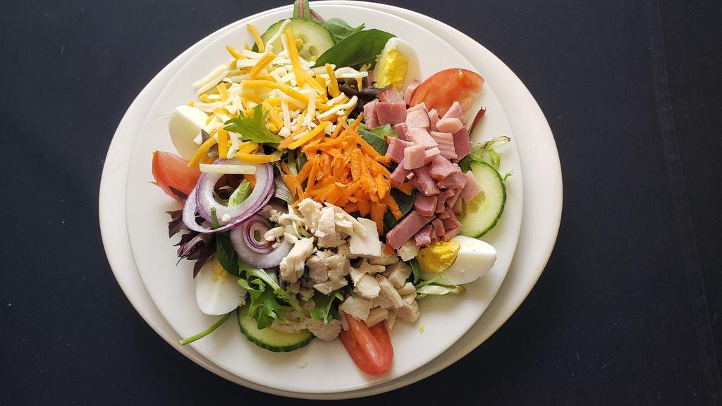 Cobb Salad · Mixed greens, diced ham and turkey, tomatos, egg, cucumbers, carrots and cheese.