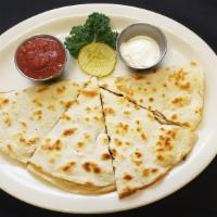 Quesadilla · Flour Tortilla with peppers, onion and melted colby jack cheese inside.  Served with salsa a...