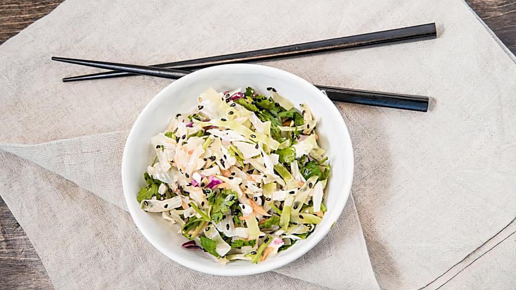 Edamame Slaw · Purple and green cabbage slaw with edamame with cilantro, scallions, carrots, sesame lime vinaigrette, and sesame seeds. Vegan. Gluten free.