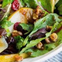 Pear Salad · Romaine lettuce, arugula, pears, tomatoes, gorgonzola, and candied walnuts with house dressi...